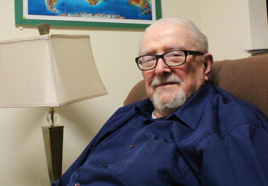 Bernie smiling with glasses