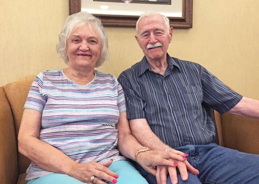 Elderly man smiling warmly indoors
