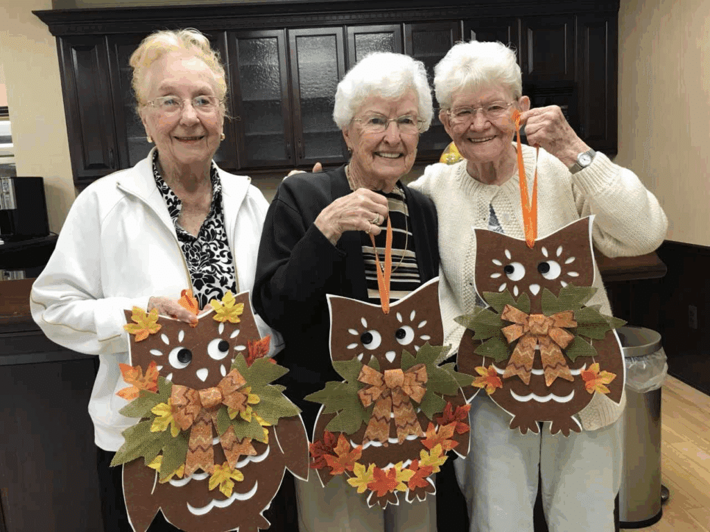 Group of people smiling during indoor gathering