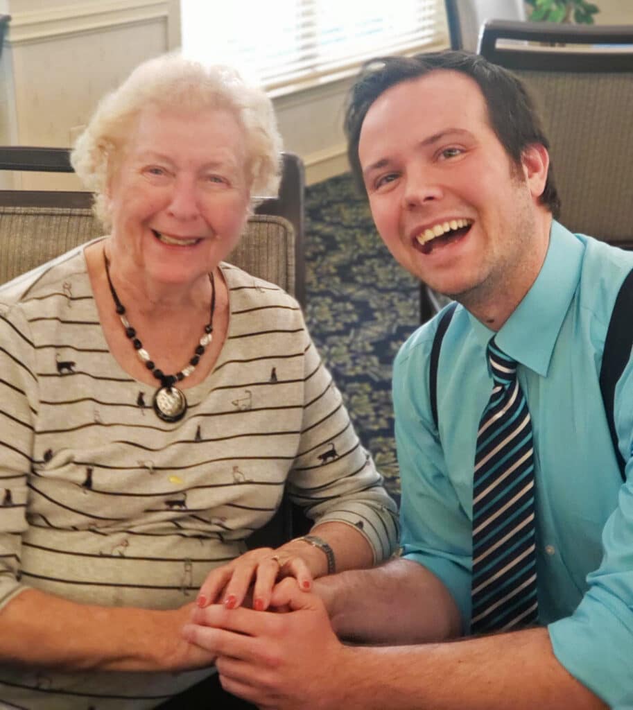 Elderly couple smiling warmly during activity indoors