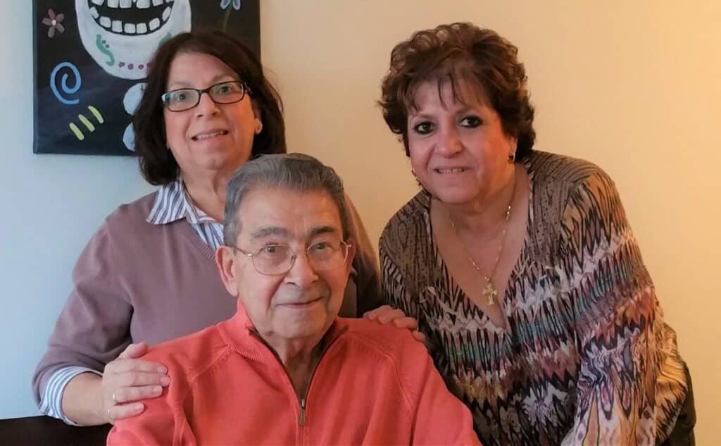 Elderly couple smiling together in portrait indoors
