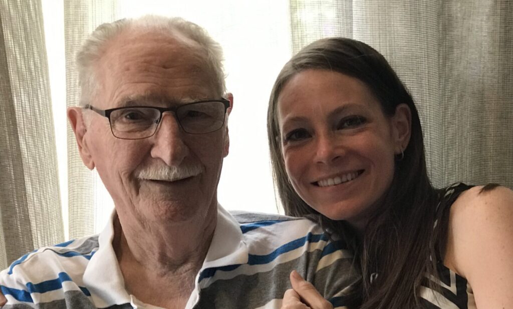 Elderly couple smiling warmly during indoor photo