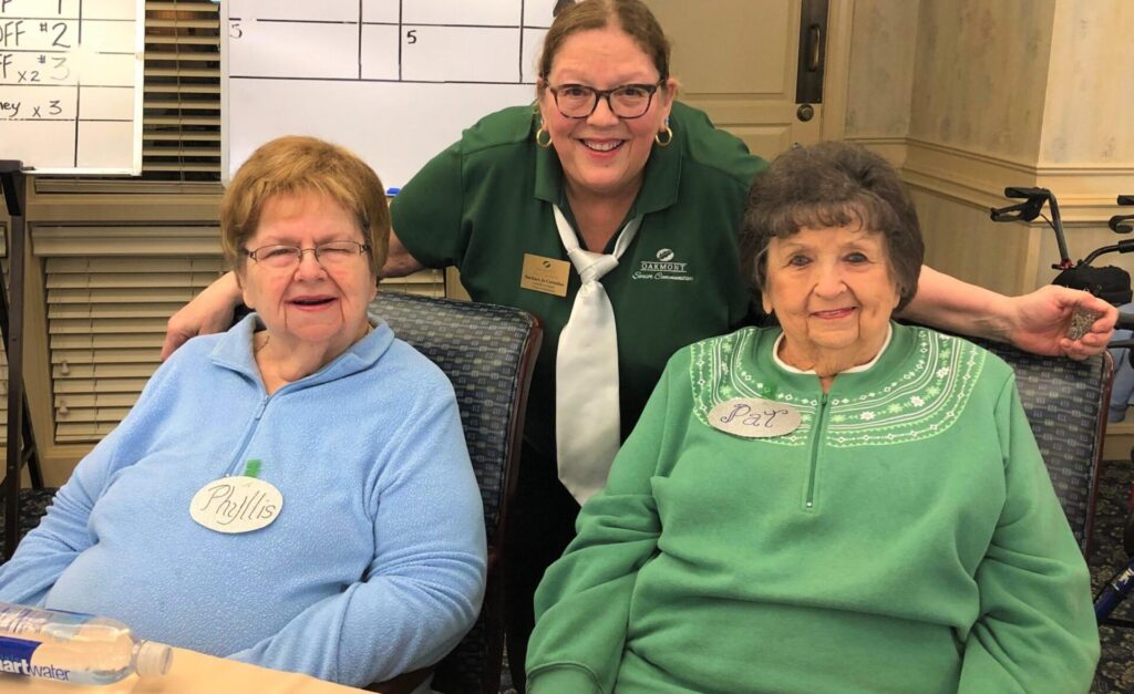 Senior group smiling together during indoor activity