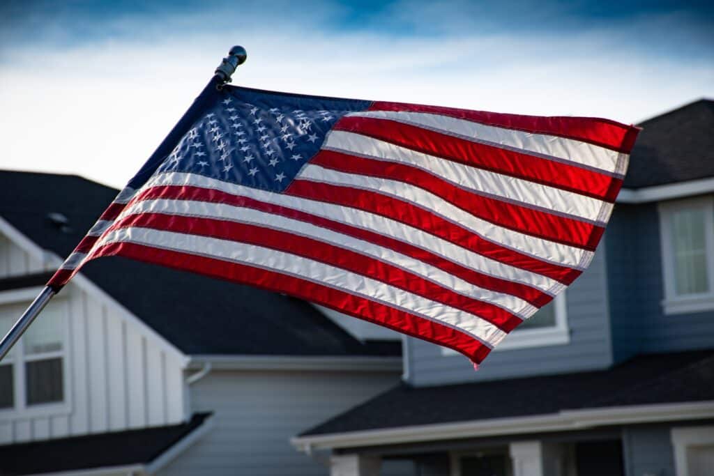 American flag waving on a clear blue sky