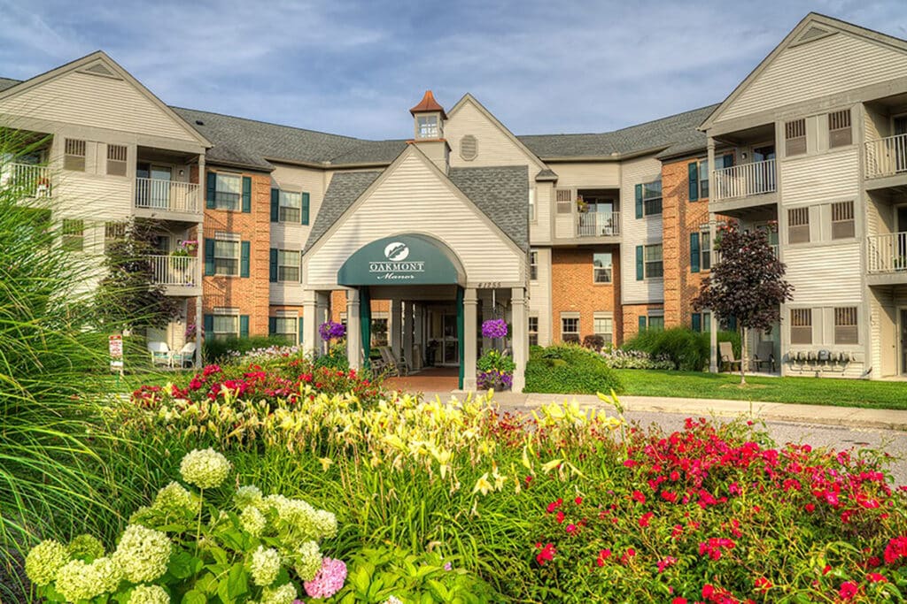 Senior living community exterior garden with landscaped greenery