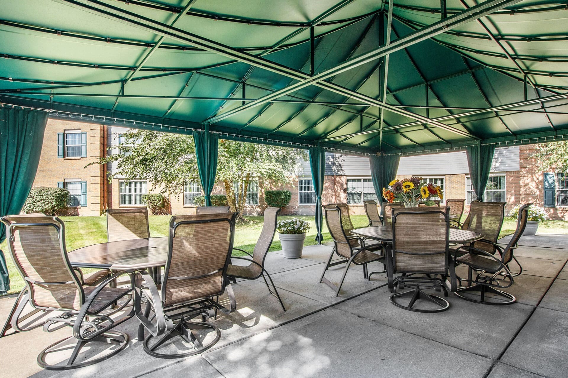 Outdoor canopy area with tables and chairs at Parkway