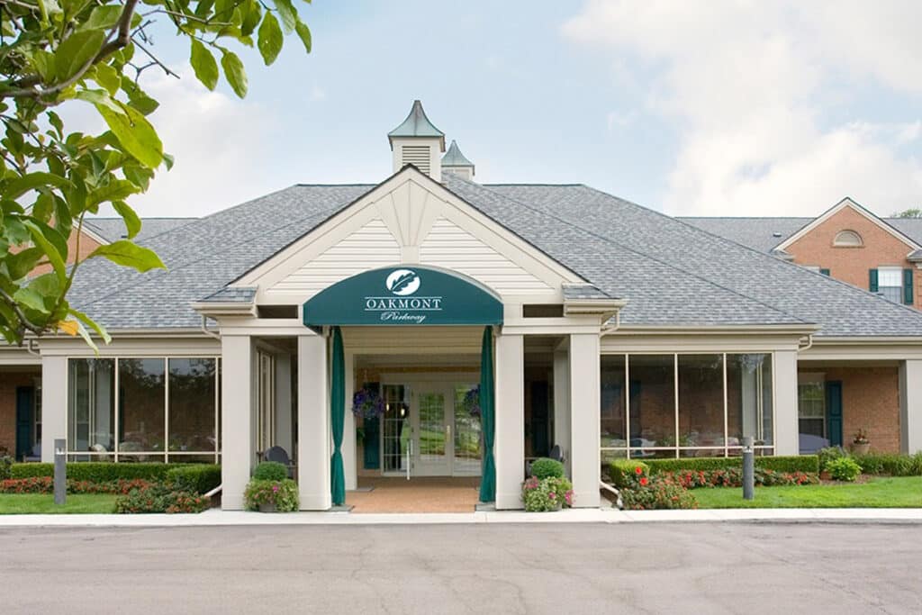 Exterior entrance of Parkway senior living community with landscaped walkway