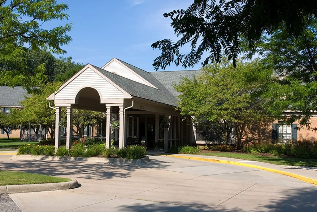Senior living community exterior front view with landscaping